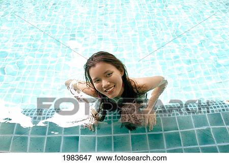 Thailand, Bangkok, Thai Woman In Swimming Pool. View Large Photo Image Stock Photo - Thailand, Bangkok, Thai Woman In Swimming Pool.. Fotosearch