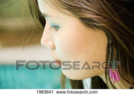 Stock Image - Thailand, Bangkok, Thai Woman Next To Pool.. Fotosearch
