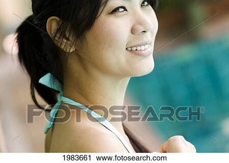 Thailand, Bangkok, Thai Woman Next To Pool. View Large Photo Image Stock Image - Thailand, Bangkok, Thai Woman Next To Pool.. Fotosearch