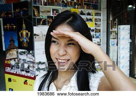 Stock Photograph - Thailand, Bangkok, Thai Woman Shopping Along The Street.. Fotosearch