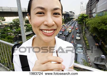 Thailand, Bangkok, Thai Woman Smiling With Drink. View Large Photo Image Picture - Thailand, Bangkok, Thai Woman Smiling With Drink.. Fotosearch