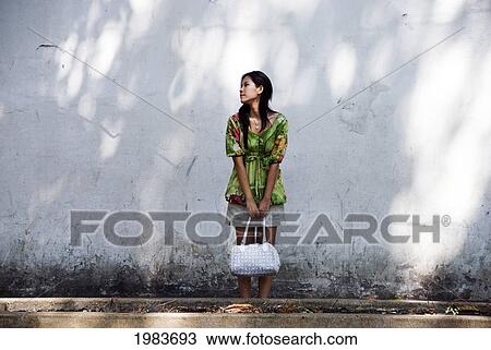 Thailand, Bangkok, Thai Woman Standing Outside. View Large Photo Image Stock Image - Thailand, Bangkok, Thai Woman Standing Outside.. Fotosearch