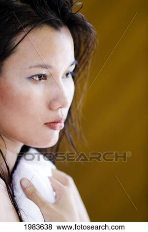 Stock Photo - Thailand, Bangkok, Thai Woman Toweling Herself Dry.. Fotosearch