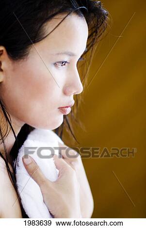 Stock Photo - Thailand, Bangkok, Thai Woman Toweling Herself Dry.. Fotosearch