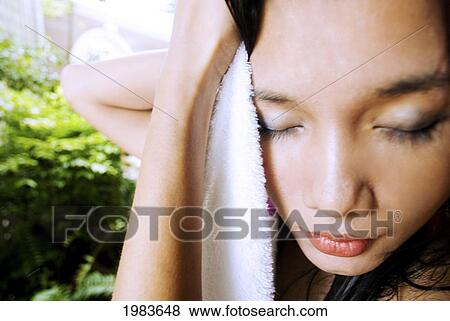 Stock Photo - Thailand, Bangkok, Thai Woman Toweling Herself Dry.. Fotosearch