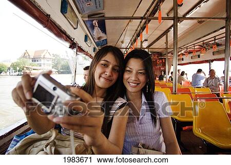 Thailand, Bangkok, Thai Women Take A Photo Of Themselves. View Large Photo Image Stock Image - Thailand, Bangkok, Thai Women Take A Photo Of Themselves.. Fotosearch