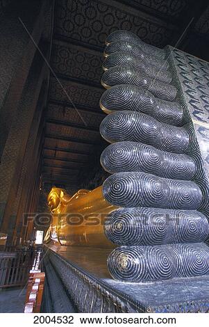 Stock Image - Thailand, Bangkok, Wat Pho Close-Up Reclining Buddha Underside Of Feet To Head, Golden Statue Largest 46 Meters Long Indoors. Fotosearch