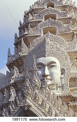 Stock Image - Thailand, Bangkok, Wat Ratchapradt, Buddha Image On Ornate Stone Temple.. Fotosearch