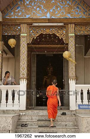 Thailand, Chiang Mai, Buddhist Monk Entering Temple At Wat Suandok. View Large Photo Image Stock Image - Thailand, Chiang Mai, Buddhist Monk Entering Temple At Wat Suandok.. Fotosearch