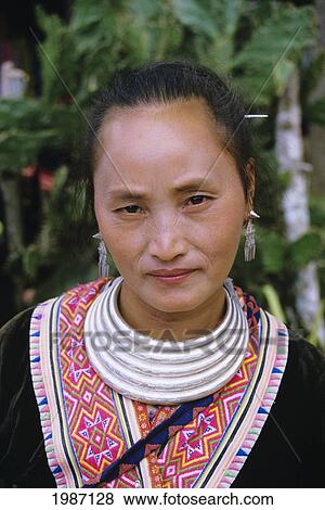 Stock Photo - Thailand, Chiang Mai, Portrait Of H'mong Woman In Traditional Dress. Editorial Use Only.. Fotosearch
