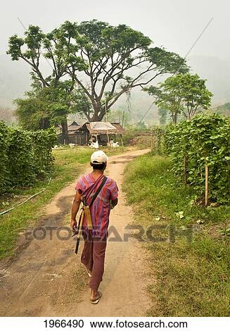 Thailand, Chiang Mai Province, Guide Leads The Way To The Patara Elephant Farm. View Large Photo Image Stock Image - Thailand, Chiang Mai Province, Guide Leads The Way To The Patara Elephant Farm.. Fotosearch