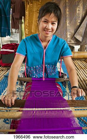 Thailand, Chiang Mai Province, Patara Elephant Farm, Young Woman Weaves Colorful Fabric On Loom. View Large Photo Image Stock Photograph - Thailand, Chiang Mai Province, Patara Elephant Farm, Young Woman Weaves Colorful Fabric On Loom.. Fotosearch