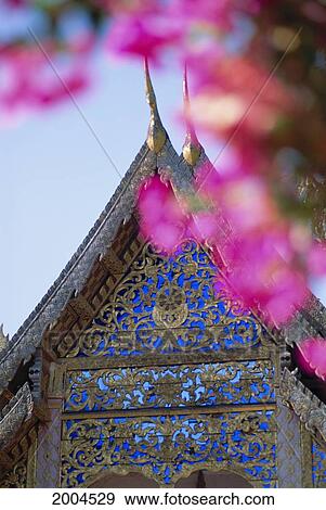 Thailand, Chiang Mai, Wat Doi Suthep Temple Exterior Detail Of Steeple Pink Flower Blossom Foreground Frame View Large Photo Image Stock Photo - Thailand, Chiang Mai, Wat Doi Suthep Temple Exterior Detail Of Steeple Pink Flower Blossom Foreground Frame. Fotosearch