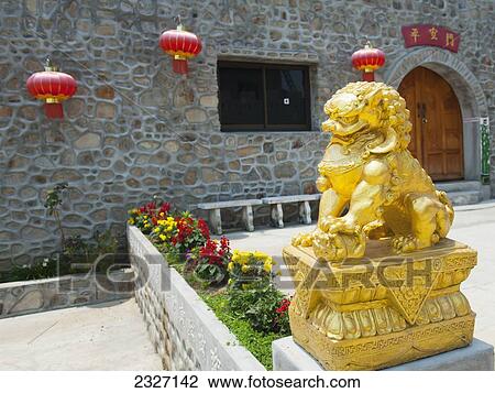 Stock Image - Thailand, Golden lion statue outside building; Shandicun. Fotosearch