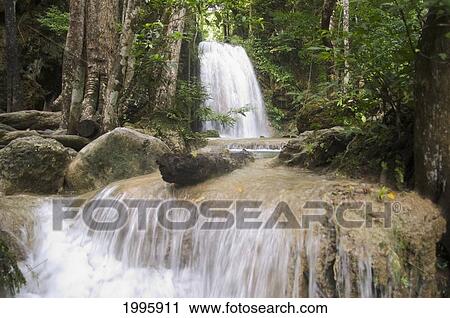 Thailand, Kanchanaburi Province, Erawan National Park, One Of The Falls From The 7-Tiered Erawan Waterfall View Large Photo Image Stock Image - Thailand, Kanchanaburi Province, Erawan National Park, One Of The Falls From The 7-Tiered Erawan Waterfall. Fotosearch