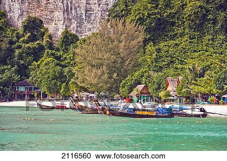 Thailand, Koh Phi Phi, Longtail boats along the shoreline. View Large Photo Image Stock Image - Thailand, Koh Phi Phi, Longtail boats along the shoreline.. Fotosearch