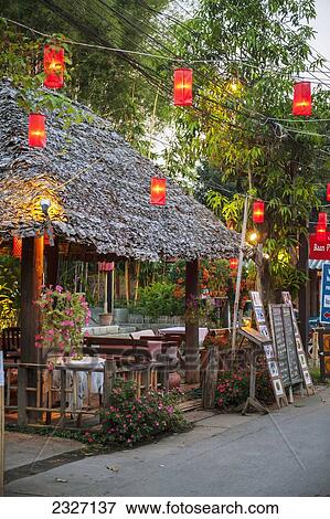 Stock Photo - Thailand, Lanterns hanging over street lined with retail shops; Pai. Fotosearch