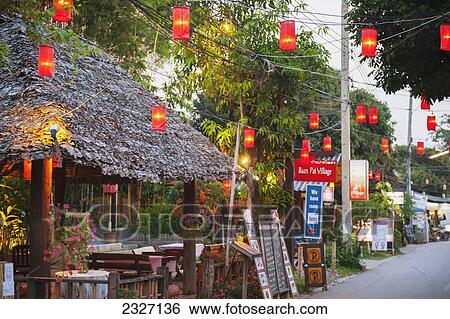 Thailand, Lanterns hanging over street lined with retail shops; Pai View Large Photo Image Stock Photograph - Thailand, Lanterns hanging over street lined with retail shops; Pai. Fotosearch