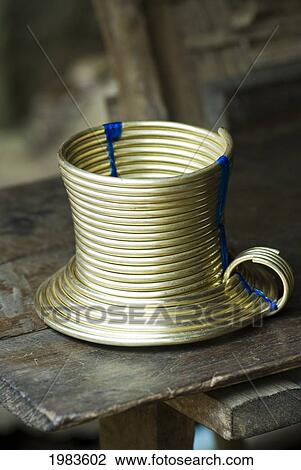 Stock Image - Thailand, Mae Hong Son Province, Brass rings worn around necks of Karen Villagers; Ban Huai Sua Tao. Fotosearch
