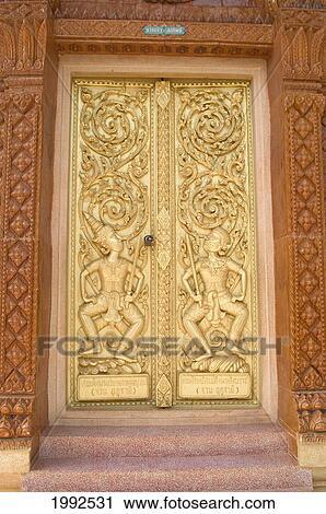 Stock Image - Thailand, Nong Bua Lumphu, Intricate Detail Of Carved Golden Temple Doors.. Fotosearch