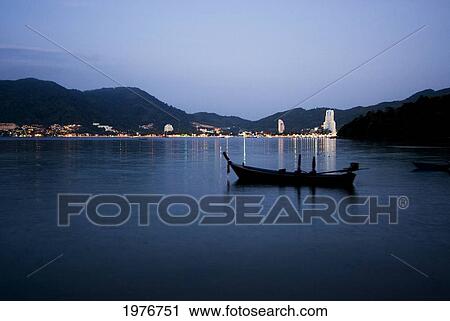 Thailand, Phuket, Longtail Boat And Lights Reflecting At Dusk; Patong View Large Photo Image Stock Image - Thailand, Phuket, Longtail Boat And Lights Reflecting At Dusk; Patong. Fotosearch