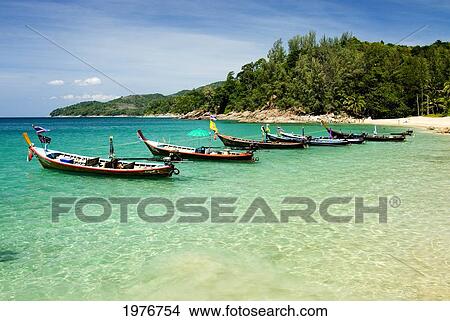 Picture - Thailand, Phuket, Longtail Boats And Clear Blue Water At Secluded Beach On Andaman Coast.. Fotosearch