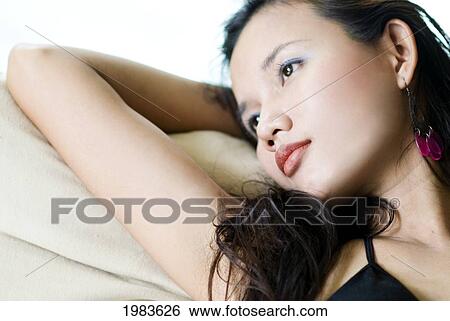 Thailand, Portrait of woman relaxing; Bangkok View Large Photo Image Stock Photograph - Thailand, Portrait of woman relaxing; Bangkok. Fotosearch