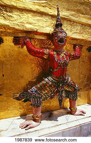 Stock Photo - Thailand, Ramakien statue in colorful outfit and headdress in Wat Phra Keo; Bangkok. Fotosearch