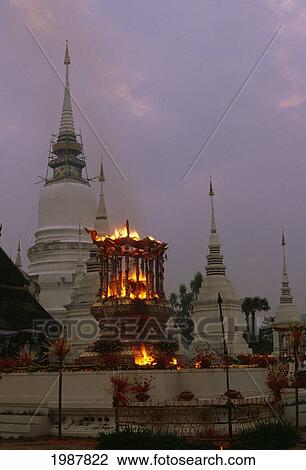 Stock Image - Thailand, Royal Cremation in front of temple at sunset; Chiang Mai. Fotosearch