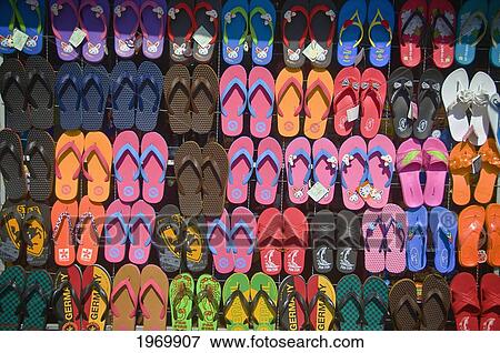 Thailand, Si Sawat, Inexpensive Flip Flops Are For Sale Almost Everywhere You Look In Thailand. View Large Photo Image Stock Photo - Thailand, Si Sawat, Inexpensive Flip Flops Are For Sale Almost Everywhere You Look In Thailand.. Fotosearch