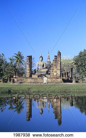 Thailand, Sukhothai, Buddha Statue And Pillars Reflecting In Pond; Wat Mahathat View Large Photo Image Stock Photo - Thailand, Sukhothai, Buddha Statue And Pillars Reflecting In Pond; Wat Mahathat. Fotosearch
