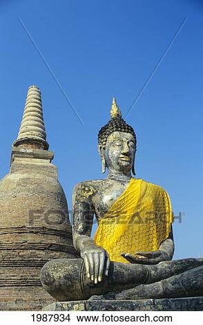 Picture - Thailand, Sukhothai, View of Buddha Statue And Temple; Wat Mahathat. Fotosearch