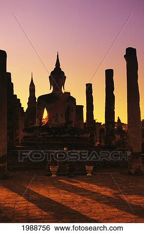 Thailand, Sukhothai, Wat Mahathat, Buddha And Pillars Backlit At Sunset View Large Photo Image Stock Photograph - Thailand, Sukhothai, Wat Mahathat, Buddha And Pillars Backlit At Sunset. Fotosearch