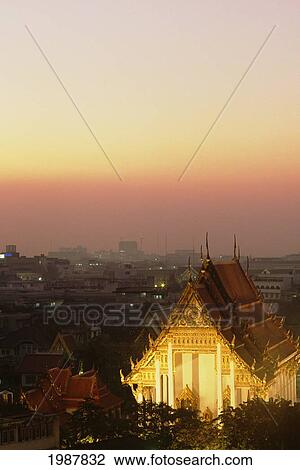 Stock Image - Thailand, Wat Saket Temple at sunset with evening lights; Bangkok. Fotosearch