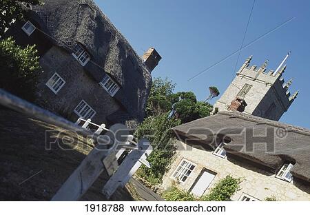 Thatch Cottage & Church In Godshill View Large Photo Image Stock Photo - Thatch Cottage & Church In Godshill. Fotosearch