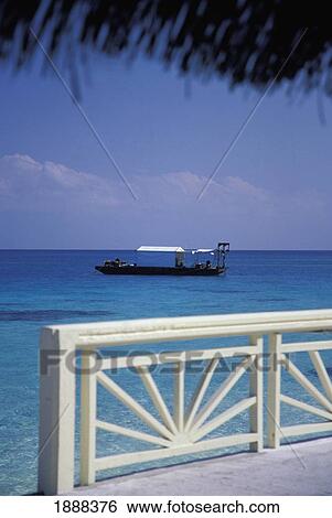 Stock Photograph - Thatched Hut And Balcony Overlooking Sea. Fotosearch
