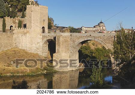 The Alcantara Bridge Over The Tagus River; Toledo Toledo Province Castilla La Mancha Spain View Large Photo Image Stock Photograph - The Alcantara Bridge Over The Tagus River; Toledo Toledo Province Castilla La Mancha Spain. Fotosearch