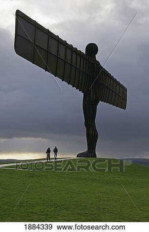 The Angel Of The North Sculpture At Dusk With Two Tourists View Large Photo Image Stock Photo - The Angel Of The North Sculpture At Dusk With Two Tourists. Fotosearch