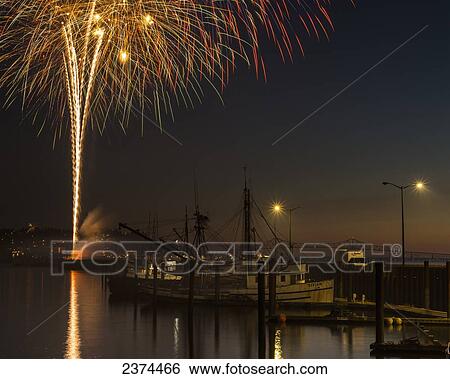 The annual July fourth fireworks brighten the Astoria sky; Astoria, Oregon, United States of America View Large Photo Image Stock Photograph - The annual July fourth fireworks brighten the Astoria sky; Astoria, Oregon, United States of America. Fotosearch