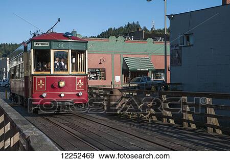 Stock Photo - The Astoria trolley carries passengers along the riverfront; Astoria, Oregon, United States of America. Fotosearch