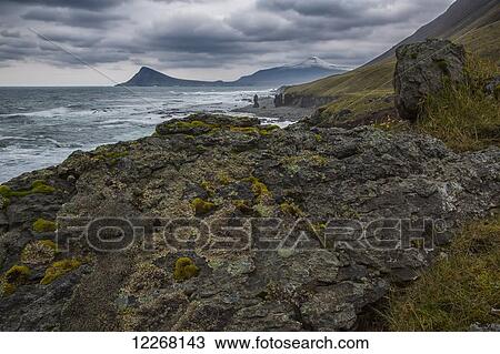 Stock Image - The Atlantic Ocean hits the Strandir coastline which lies in the West Fjords in the northwest of Iceland; Iceland. Fotosearch