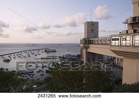 Stock Photography - The Atlantic Ocean seen from the upper town, with the public Lacerda lift linking the upper and lower towns; Salvador, Brazil. Fotosearch