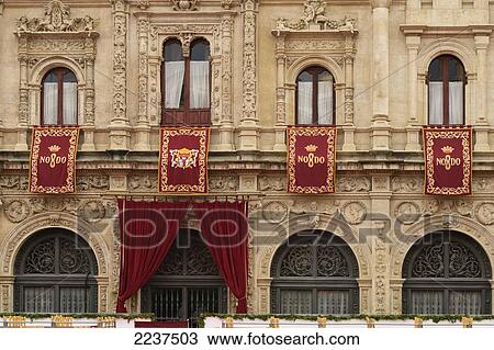 The Ayuntamiento (Town Hall) Of Seville Displaying The Cities Motto - No8Do (The Figure 8 Represents A Skein Of Yarn The Motto Means - Seville Has Not Abandoned Me); Seville Spain View Large Photo Image Stock Image - The Ayuntamiento (Town Hall) Of Seville Displaying The Cities Motto - No8Do (The Figure 8 Represents A Skein Of Yarn The Motto Means - Seville Has Not Abandoned Me); Seville Spain. Fotosearch