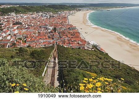 The Beach Along The Bay And Funicular; Nazare, Portugal View Large Photo Image Stock Photo - The Beach Along The Bay And Funicular; Nazare, Portugal. Fotosearch