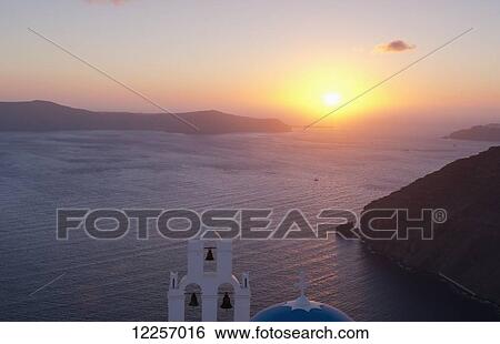 The blue domed Greek Orthodox church overlooking the caldera at sunset; Firostefani, Santorini, Cyclades, Greek Islands, Greece View Large Photo Image Stock Photograph - The blue domed Greek Orthodox church overlooking the caldera at sunset; Firostefani, Santorini, Cyclades, Greek Islands, Greece. Fotosearch