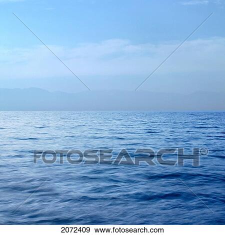 Stock Photo - The Blue Ocean With Mountains In The Distance, Victoria, Vancouver Island, British Columbia, Canada. Fotosearch
