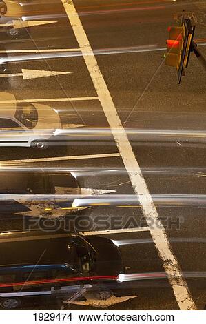 Picture - The blur of headlights and taillights from vehicles on a road; Casablanca, Morocco. Fotosearch