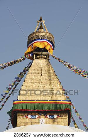Stock Photo - The Buddhist stupa of Boudhanath dominates the skyline and is one of the largest in the world; Boudhanath, Nepal. Fotosearch