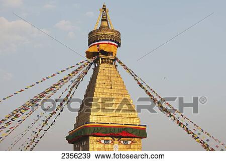 Stock Photo - The Buddhist stupa of Boudhanath dominates the skyline and is one of the largest in the world; Boudhanath, Nepal. Fotosearch