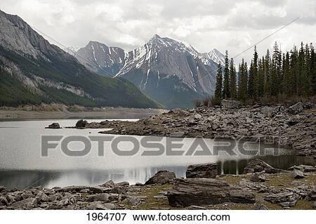 Stock Photo - The Canadian Rocky Mountains And Medicine Lake In Jasper National Park; Jasper Alberta Canada. Fotosearch
